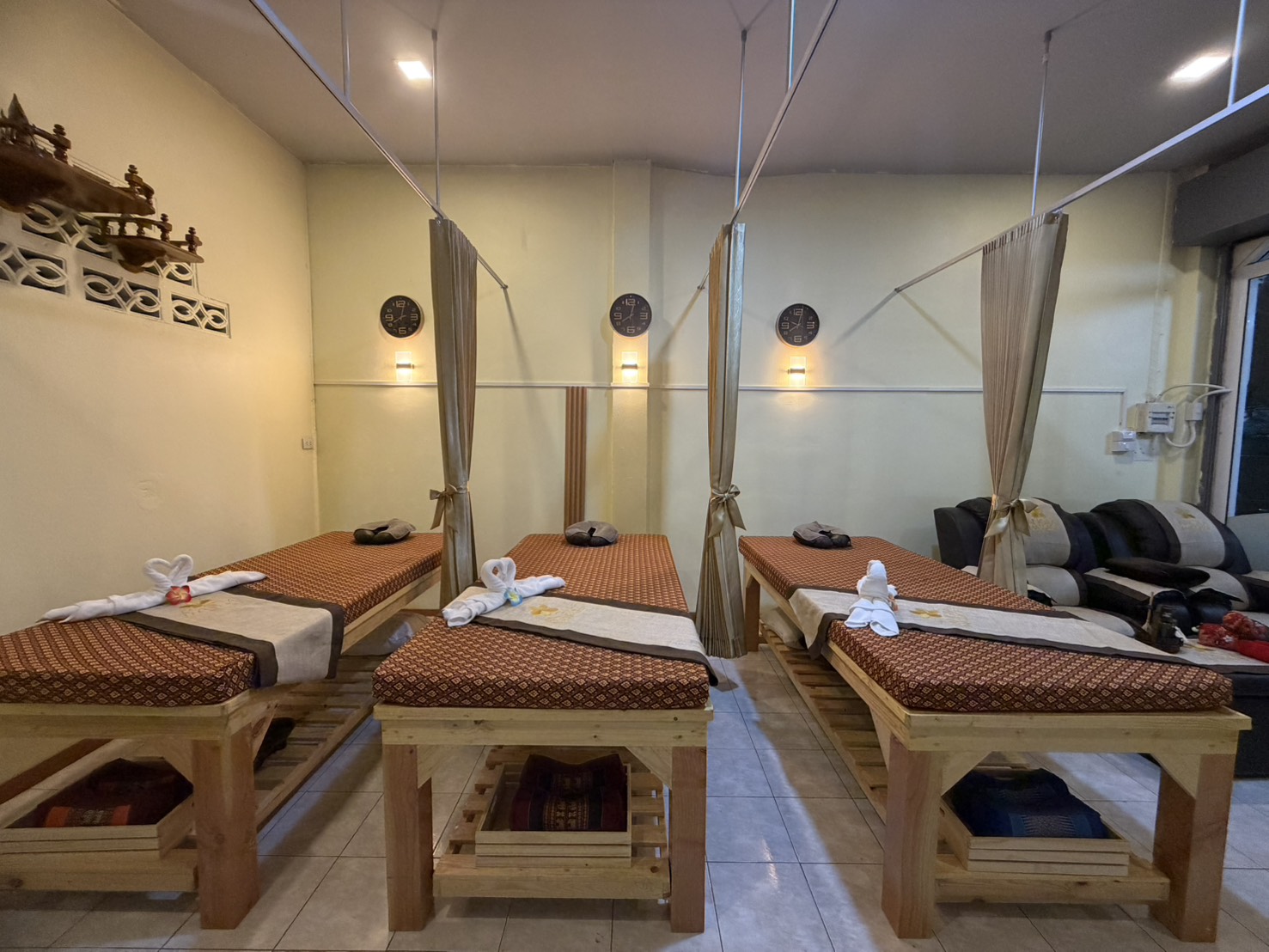 Srithanu Massage Stations with Tied Gold Privacy Curtains
